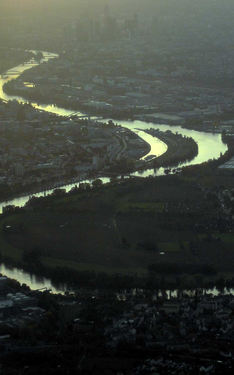 aerial view of a river through a city in Western Europe